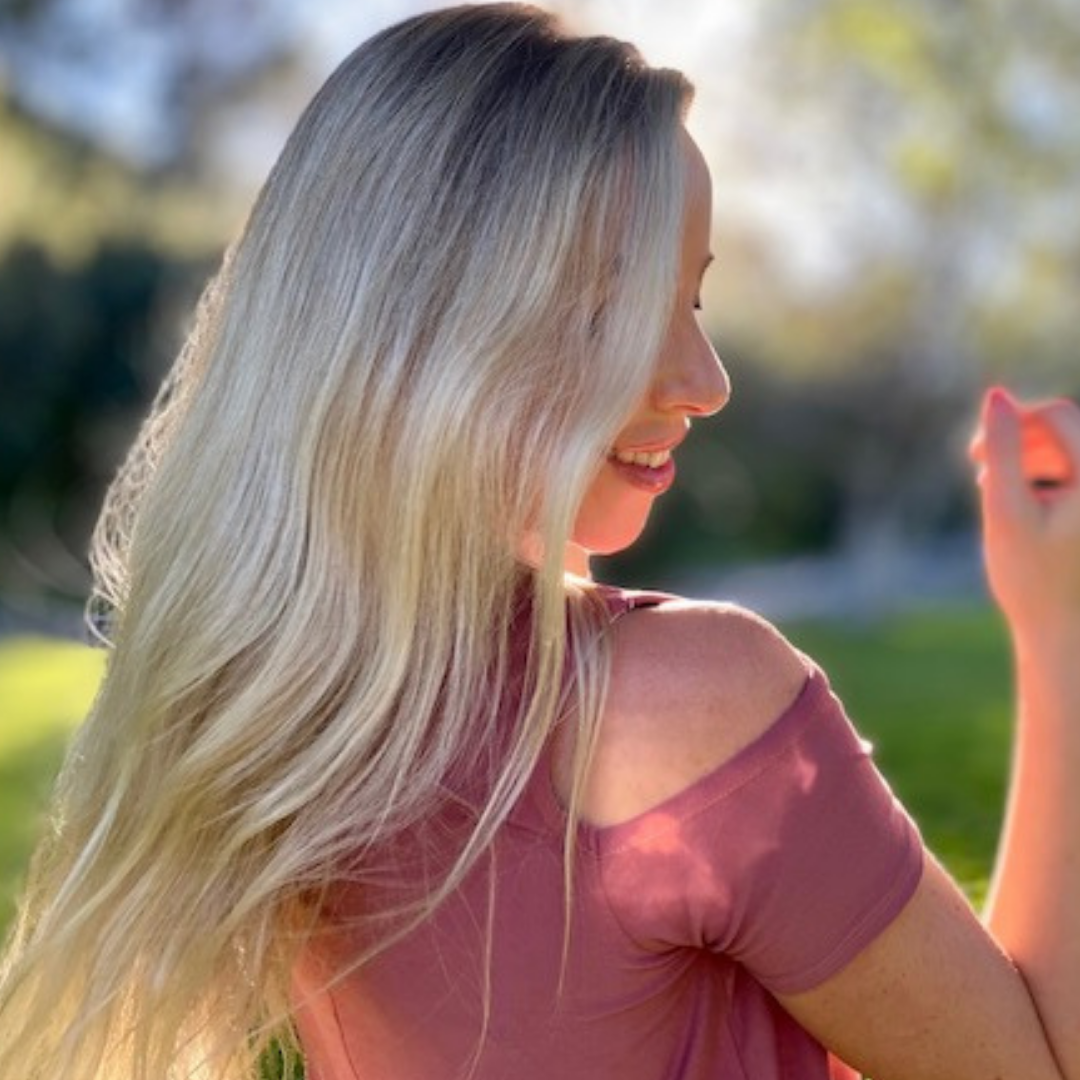 Blonde woman with long fine hair smiling